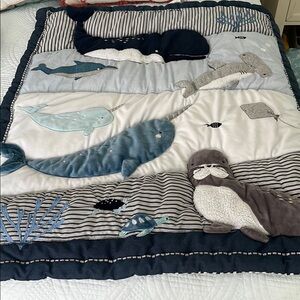 Nojo Ocean-Themed Baby Quilt and crib skirt to match